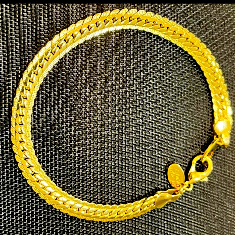 Gold tone bracelets.
